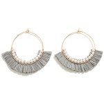 Dainty Circular Drop Earring With Pearl and Raffia Tassel Detail

- Approximately 2" L