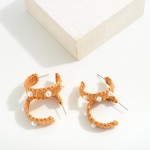 Raffia Hoop Earrings With Pearl Accents

- Approximately 1.25" D