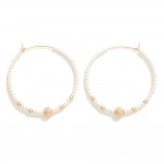 Seed beaded Hoop Earrings

- Approximately 1.75" D