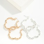 Metal Tone Bamboo Clover Hoop Earrings 

- Approximately 1.5" D
- Hypoallergenic Brass Base 