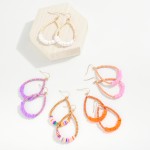 Beaded Teardrop Drop Earrings Featuring Wood and Puka Shell Beads

- Approximately 2.5" L