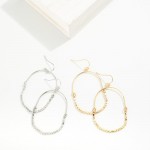 Metal Tone Elongated Drop Hoop Earrings

- Approximately 2.25" L