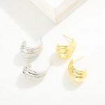 Do Everything In Love Ridged Metal Tone Post Drop Hoop Earrings With Cubic Zirconia Detail 

- Brass Base
- Hypoallergenic
- White / 14K Gold Dipped
- Made In Korea
- Approximately .5" D