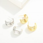 Do Everything In Love Ridged Hoop Earrings With Cubic Zirconia 'X' Detail 

- Brass Base
- Hypoallergenic
- White / 14K Gold Dipped
- Made In Korea
- Approximately 1" D