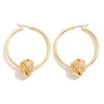 Brass Hoop Earrings With Dimpled Knot Charm Detail

- Brass Base
- Approximately 