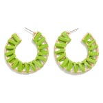 Circular Drop Earring Featuring Raffia Wrapped Detail

- Approximately 2"L