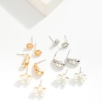 Set of Three Metal Tone and Pearl Flower Stud Earrings

- Approximately .25" - .75" L