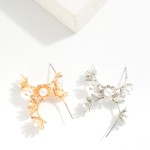 Metal Flower Hoop Earrings Featuring Pearl Details 

- Approximately .75" D