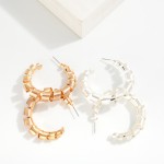 Flat Twisted Metal Hoop Earrings 

- Approximately 1.25" D