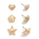 Set Of Three Metal Tone Stud Earrings Featuring Heart, Flower, & Star

- Approximately .75" L