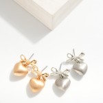 Metal Bow Heart Drop Earrings

- Approximately 2"L