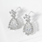 Cubic Zirconia Teardrop Post Drop Earrings Featuring Metal Tone Flower Border 

- Gold Dipped
- Approximately .75" L