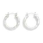 Textured Metal Hoop Earrings 

- Stainless Steel
- Water Resistant
- Approximately .75" L