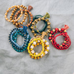 Wholesale wood beaded stretch bracelet set faceted bead details raffia tassel ac