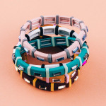 Two tone rhinestone block stretch bracelet. Approximately 3" in diameter unstretched. Fits up to a 6" wrist.