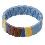 Shiny enamel coated triangle color block stretch bracelet.

- Approximately 3" in diameter unstretched
- Fits up to a 7" wrist