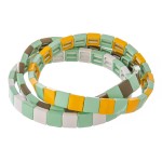 Shiny enamel coated color block stretch bracelet set.

- 3pcs/pack
- Approximately 3" in diameter unstretched
- Fits up to a 7" wrist