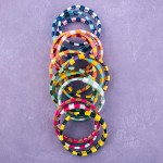 Shiny enamel coated color block stretch bracelet set.

- 3pcs/pack
- Approximately 3" in diameter unstretched
- Fits up to a 7" wrist