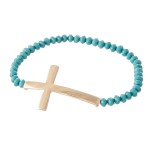 Beaded Cross Stretch Bracelet.

- Cross 1.5" 
- Approximately 3" in Diameter
- Fits up to a 7" Wrist