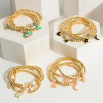 Set of Four Gold Charm Bracelets featuring Beaded Accents.

- Approximately 2.5" in Diameter