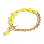 Gold Tone Rope Chain Link Bracelet Featuring Ceramic Heart Beads

- Approximately 3" Diameter