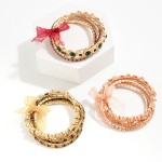 Set of Three Rhinestone Studded Stretch Bracelets Featuring Bow Accent.

- Approximately 2.5" Diameter