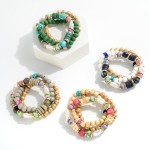 Set of 3 Beaded Stretch Bracelets Featuring Dimpleted, Wood and Rhinestone Accents 

- Approximately 2.5" Diameter  