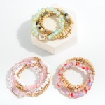 Set of 4 Beaded Stretch Bracelet Featuring Wood, Gold and Rhinestone Accents

- Approximately 2.5" Diameter 