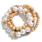 Set of Four Beaded Stretch Bracelets Featuring Pearl, Stone, Wood and Curvy Disc Beads

- Approximately 2.5 " Diameter 