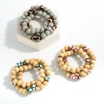 Set of Three Beaded Stretch Bracelet Featuring Wood, Disc, and Painted Honeycomb Beads 

- Approximately 2.5" Diameter 