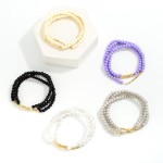 Set of Three Beaded Stretch Bracelets With Dainty Gold Tone Bead Accents

- Approximately 2.5" Diameter