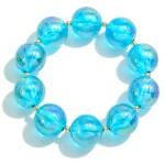 Chunky Circular Bead Stretch Bracelet With Gold Tone Accents

- Approximately 2.25" Diameter  