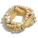 Set of 3 Beaded Stretch Bracelets Featuring Wood, Stone, and Porcelain Beads

- Approximately 2.5" Diameter 