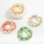 Set of Four Glass Beaded Stretch Bracelets With Gold Tone Accents

 - Approximately 2.5" Diameter