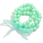 Set of Three Pearlescent Beaded Stretch Bracelets With Tied Bow Detail

- Approximately 2.5" D