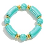 Chunky Abalone Tube and Circular Bead Stretch Bracelet With Gold Tone Accents

- Approximately 2.5" D