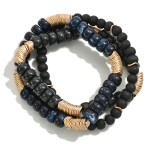 Set of Three Beaded Stretch Bracelets Featuring Wood, Acetate, and Wavy Gold Tone Disk Beads

- Approximately 2.5" D