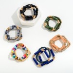 Set of Three Beaded Stretch Bracelets Featuring Wood, Acetate, and Wavy Gold Tone Disk Beads

- Approximately 2.5" D