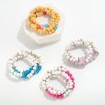 Set of Three Beaded Stretch Bracelets Featuring Wood Beads and Acetate Bead Accents

- Approximately 2.5" D