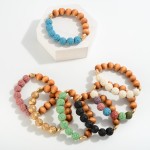 Wood Bead Stretch Bracelet With Lava Stone Inspired Bead Accents

- Approximately 2.5" D