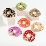 Set of Four Beaded Stretch Bracelets Featuring Rhinestone Station and Chain Link Accents

- Approximately 2.5" D