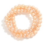 Set of Three Pearlescent Beaded Stretch Bracelets 

- Approximately 2.5" D 