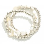 Set of Three Metal Tone Beaded Stretch Bracelets Featuring Mother of Pearl Hearts 

- Approximately 2.5" D