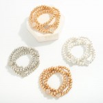 Set of Three Metallic Beaded Stretch Bracelets Featuring Rhinestone Studded Clover Stations

- Approximately 2.5" D