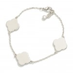 White Gold Dipped Chain Link Bracelet Featuring Metal Tone Clover Stations

- Approximately 3" D
- Extender .75" L