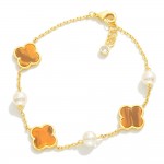 Gold Dipped Chain Link Bracelet Featuring Clover & Pearl Stations 

- Approximately 3" D
- .75" Extender 
