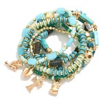 Set of Eight Mixed Media Beaded Stretch Bracelets Featuring Gold Tone Charms

- Approximately 2.5" D