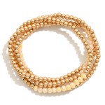 Set of Four Worn Gold Tone Beaded Stretch Bracelets Featuring Faceted Bead Focal

- Approximately 2.5" D