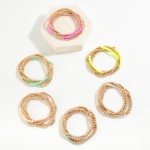 Set of Four Worn Gold Tone Beaded Stretch Bracelets Featuring Faceted Bead Focal

- Approximately 2.5" D