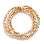 Set of Four Worn Gold Tone Beaded Stretch Bracelets Featuring Faceted Bead Focal

- Approximately 2.5" D